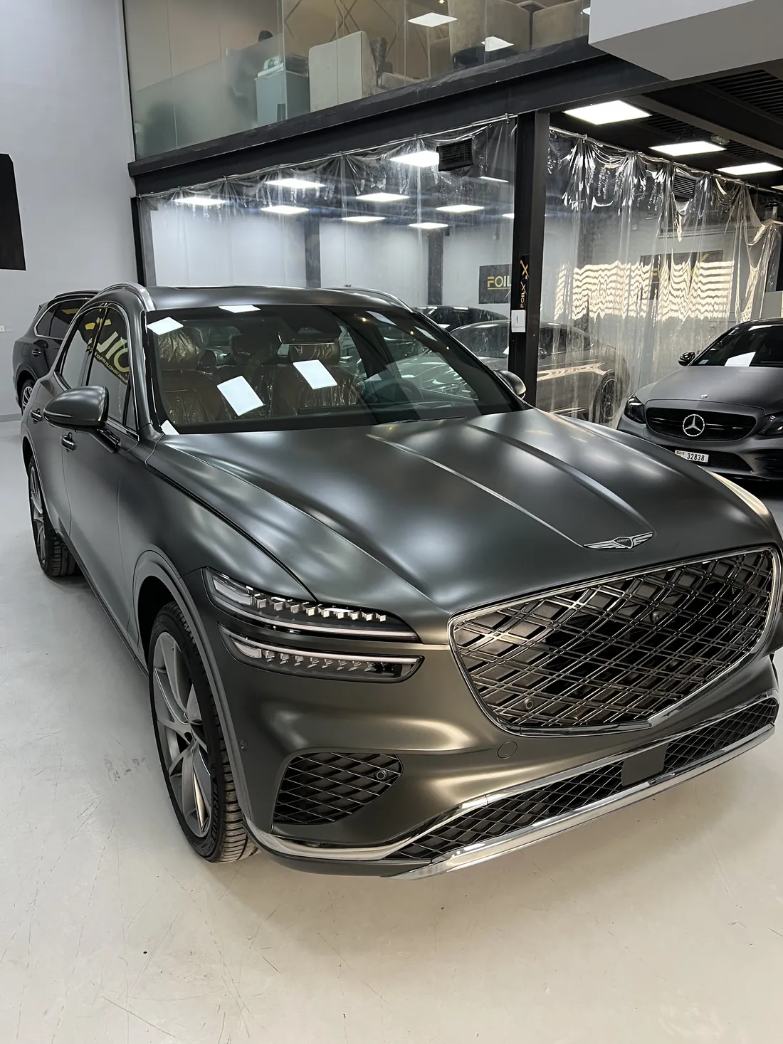 Genesis GV70 wrapped in matte black at the FoilX workshop in Al Quoz